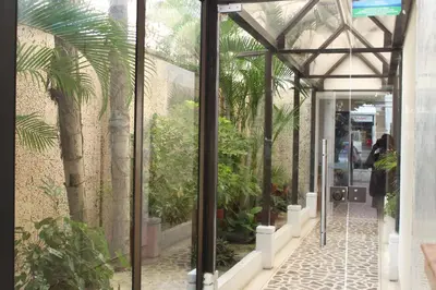 a glass door leading into a greenhouse with plants at Cartagena - Torremarina in Cartagena de Indias