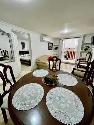 a living room with a wooden table and chairs at Apartamento centro historico in Cartagena de Indias