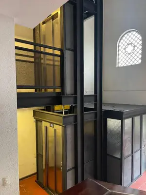 a room with a staircase with glass cabinets and a mirror at Apartamento centro historico in Cartagena de Indias