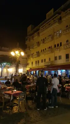 a group of people standing outside of a building at night at Apartamento 1904 El Laguito in Cartagena de Indias