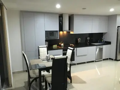 a kitchen and dining room with a table and chairs at Cartagena Beach Front in Cartagena de Indias