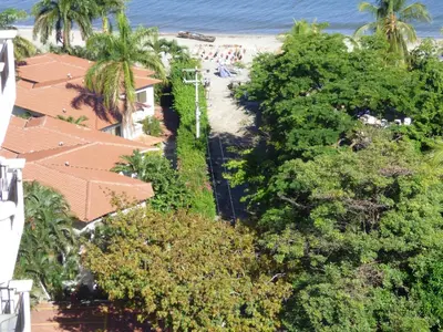 an aerial view of a beach with palm trees at Bello Horizonte * Unido Al Mar in Santa Marta