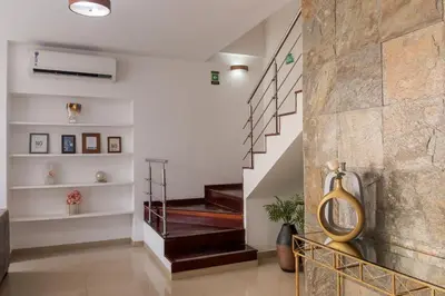 a staircase in a house with a stone wall at Hotel SEREMA in Cartagena de Indias