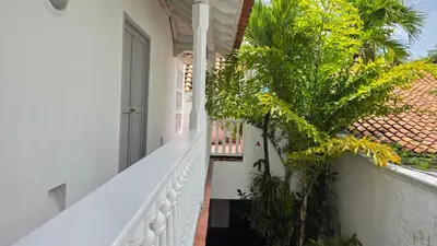 a stairway leading to a house with palm trees at Hotel Casa la Tablada in Cartagena de Indias