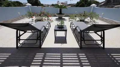 two chairs and a table on a patio at Hotel Casa Cytia in Cartagena de Indias
