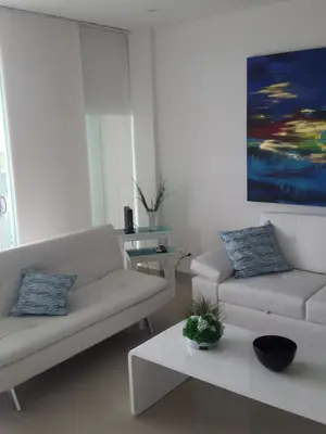 a living room with a couch and a coffee table at Apartamento Morros Epic Cartagena in Cartagena de Indias