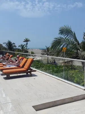 a row of lounge chairs sitting on a roof at Apartamento Morros Epic Cartagena in Cartagena de Indias