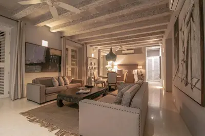a living room with couches and a table at Hotel Casa Noi in Cartagena de Indias
