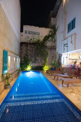 a swimming pool with blue water in a building at República Hostel Cartagena in Cartagena de Indias