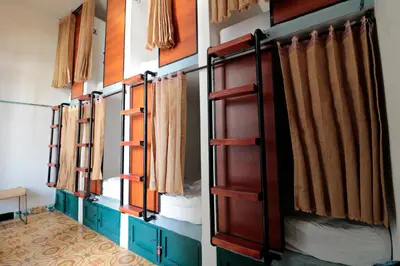a row of bunk beds in a room at República Hostel Cartagena in Cartagena de Indias