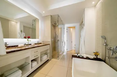 a bathroom with a tub and a sink and a shower at Hyatt Regency Cartagena in Cartagena de Indias
