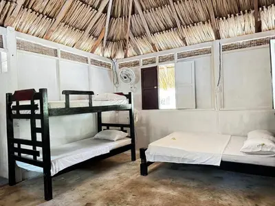 a room with two bunk beds and a window at Eco Hotel Bosque Encantado in Isla Grande