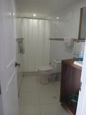 a white bathroom with a toilet and a sink at Cartagena Linda 204 in Cartagena de Indias