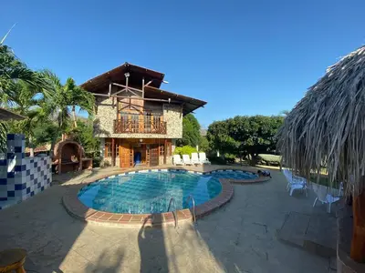 a resort with a swimming pool in front of a building at Cabana Dubai Resorts in Santa Veronica