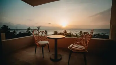 a balcony with a table and chairs and a view of the ocean at Loa Tolú by Bernalo Hotels in Tolú