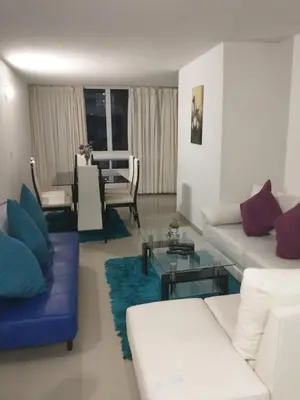a living room with a couch and a table at Apartamento Playero in Cartagena de Indias