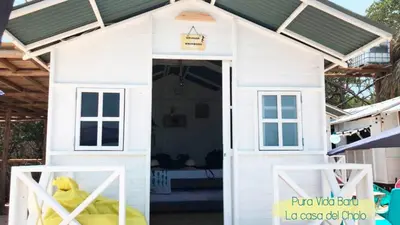 a play house with a stuffed animal in it at Pura Vida Baru - La Casa del Cholo in Baru