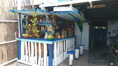 a shop with a blue counter with fruit on it at Cabaña Luna Azul in Playa Blanca