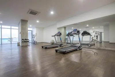 a gym with several treadmills and exercise machines at Pretty Apartment in Cartagena de Indias