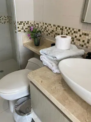 a bathroom with a toilet and a sink at Apartamento Frenta a la Playa in Cartagena de Indias