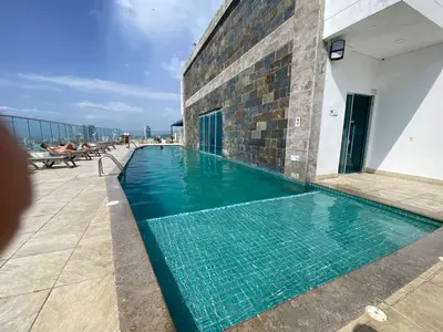 a swimming pool on the roof of a building at Apartamento Frenta a la Playa in Cartagena de Indias