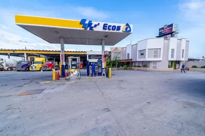 a gas station with a chevrolet sign on it at Hotel Baly Express in Malambo