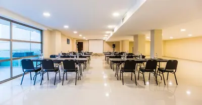 a large room with tables and chairs in it at Ribai Hotels - Barranquilla in Barranquilla