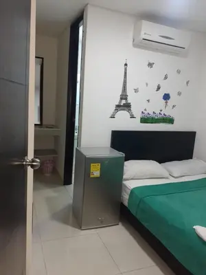 a bedroom with a bed and the eiffel tower at Hotel La Mar Cartagena in Cartagena de Indias