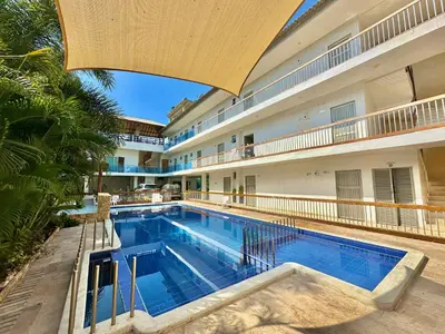 an image of a swimming pool in a building at Awa De Mar Hotel Tolu in Tolú