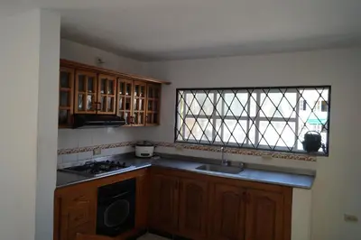 a kitchen with a sink and a window at Condominio Punta Bolivar in San Antero
