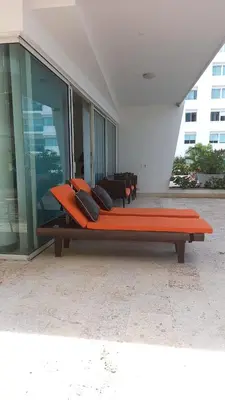 a bench sitting outside of a building at Apartamento Frente a la Playa Morros 922 in Cartagena de Indias