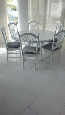 a dining room table with four chairs and a table and chairs at Apartamento Frente a la Playa Morros 922 in Cartagena de Indias