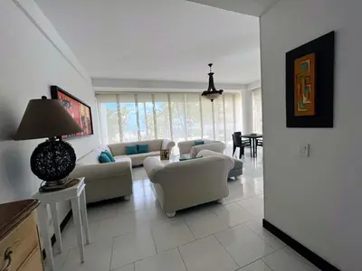 a large living room with couches and a table at Apartamento Frente a la Playa Morros 922 in Cartagena de Indias