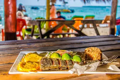 a plate of food on a table with a plate of food at Nuestros Tres Tesoros II in Playa Blanca