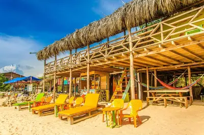 a bunch of chairs and chairs on a beach at Nuestros Tres Tesoros II in Playa Blanca