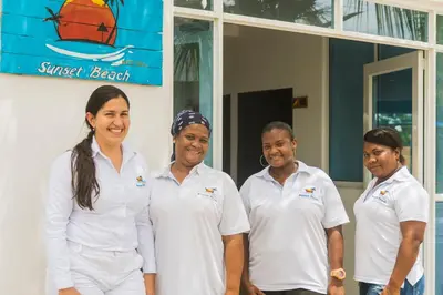 a group of people standing in front of a building at Hotel Sunset Beach in Cartagena de Indias