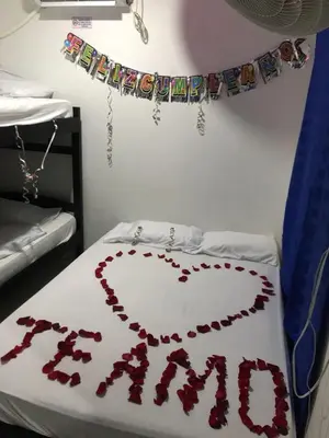 a bed with a heart made out of red roses at Hotel Don Toño Tolú in Tolú