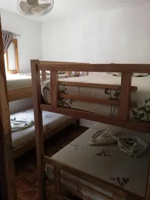 a group of bunk beds in a room at Casa Madrigueña in Rincón