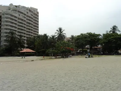 a view of a beach with a tall building at Edificio Mar de Leva in Santa Marta