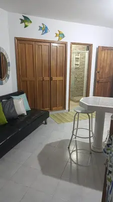 a living room with a couch and a table at Edificio Mar de Leva in Santa Marta