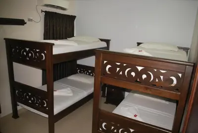 two bunk beds in a room with at Hotel Diamante Real Cienaga in Ciénaga