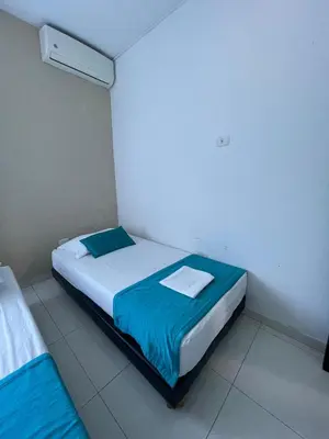 a bedroom with two beds in a room at Cabanas Villa Antonella Covenas in Coveñas