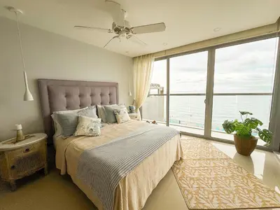 a bedroom with a bed and a large window at Namaste Alojamientos Luxury Cartagena in Cartagena de Indias