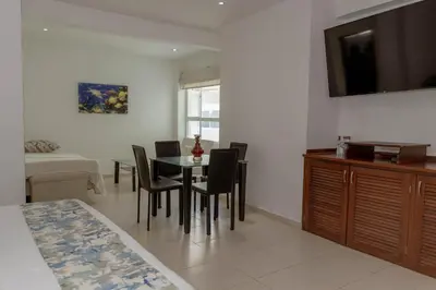 a dining room with a table and chairs at Hotel Coral Reef Cartagena in Cartagena de Indias