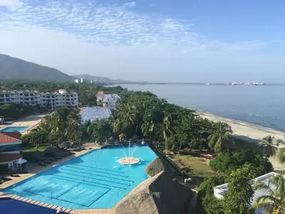 an aerial view of a resort with a swimming pool and a beach at Costa Azul Suite 606 in Santa Marta