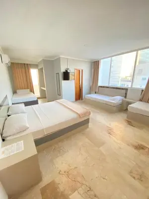 a large room with a large bed and a couch at Hotel Cartagena Premium in Cartagena de Indias