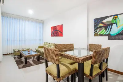 a living room with a table and chairs and a couch at Travelers Orange Cartagena in Cartagena de Indias