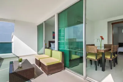 an open living room with a table and chairs at Travelers Orange Cartagena in Cartagena de Indias