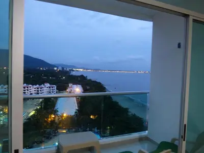 a view of the ocean from a hotel room window at Costa Azul Suites 906 in Santa Marta