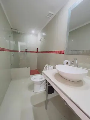 a bathroom with a sink and a toilet at Hotel Costa del Sol in Cartagena de Indias